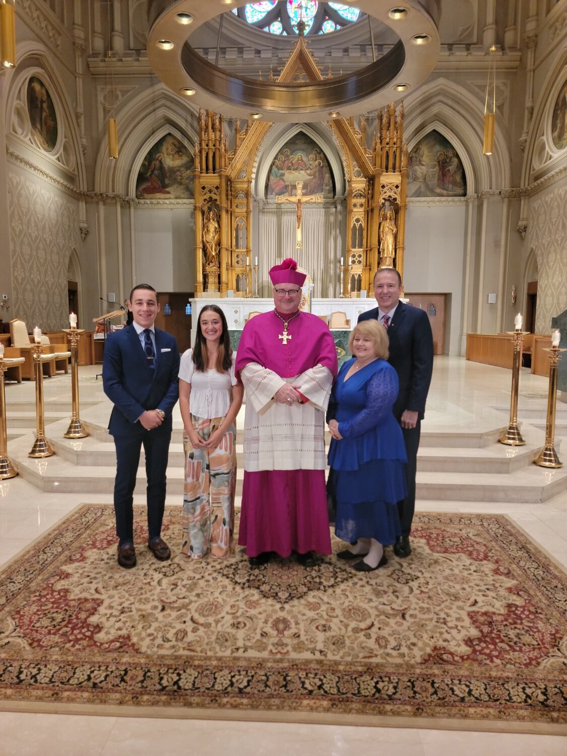 Bishop Richard G. Henning smiles with this year’s Human Life Guild Awardees including, from left, Joshua Kline, Riley Morin, and Laurie and David Mitchel.